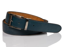 Load image into Gallery viewer, Hand made blue leather belts  The Zapato Sanchez monogram is imprinted in its metalic buckle matching the blue leather in this belt introduced for Spring 2021. The blue stitching completes the accessory.  Blue supreme blue leather with a tan coloured lining Metalic-toned hardware Belts are 1.5 inches wide and are measured from the end of the buckle to the center hole. Sizing may differ based on where the belt is worn (at the hips vs on the waist)  1.3/8 inches. Made in Canada
