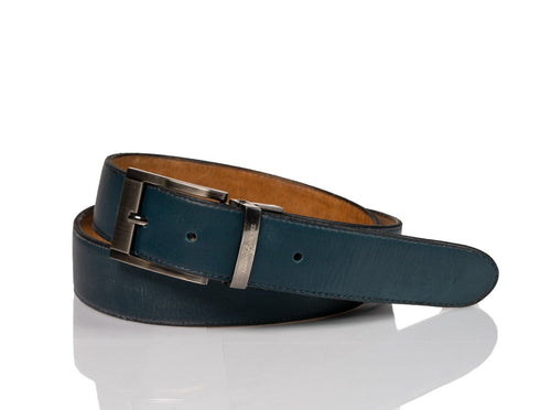 Hand made blue leather belts  The ZapatoSanchez monogram is imprinted in its metalic buckle matching the blue leather in this belt introduced for Spring 2021. The blue stitching completes the accessory.  Blue supreme blue leather with a tan coloured lining Metalic-toned hardware Belts are 1.5 inches wide and are measured from the end of the buckle to the center hole. Sizing may differ based on where the belt is worn (at the hips vs on the waist)  1.3/8 inches. Made in Canada