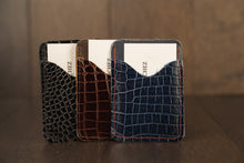 Load image into Gallery viewer, Hand made men&#39;s leather slim wallet built for style &amp; utility. It has 2 discrete pockets.  Zapato Sanchez men&#39;s wallets will fit up to 10 cards, but once additional cards are added, the leather will conform to the extra cards added. But keep in mind, that once the leather stretches to conform to the cards, the leather will not return to its original shape.   Crafted in Canada at West Edmonton Mall, this everyday companion is a great gift for the man who appreciates and understated elegance.
